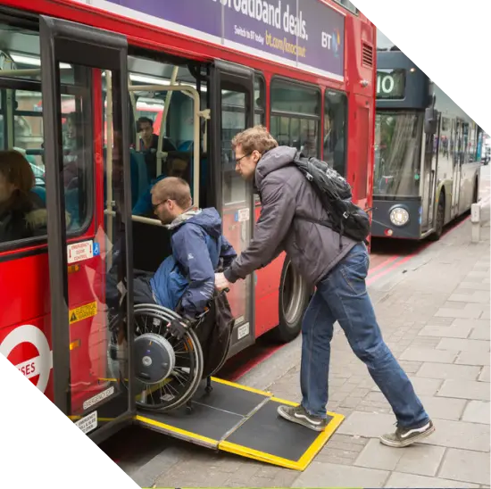 Wheelchair user boarding a 59 double decker bus